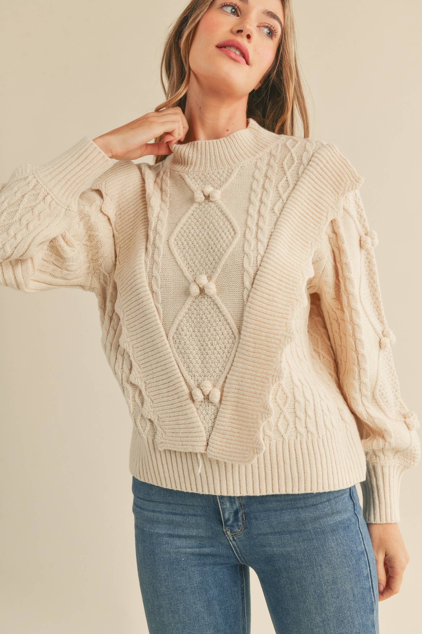 MOCK NECK CABLE KNIT PULLOVER WITH POM POMS IVORY,